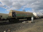 BN coil car with an interesting BNSF cascade green cover.